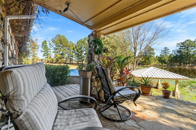 view of patio / terrace featuring a gazebo and a water view