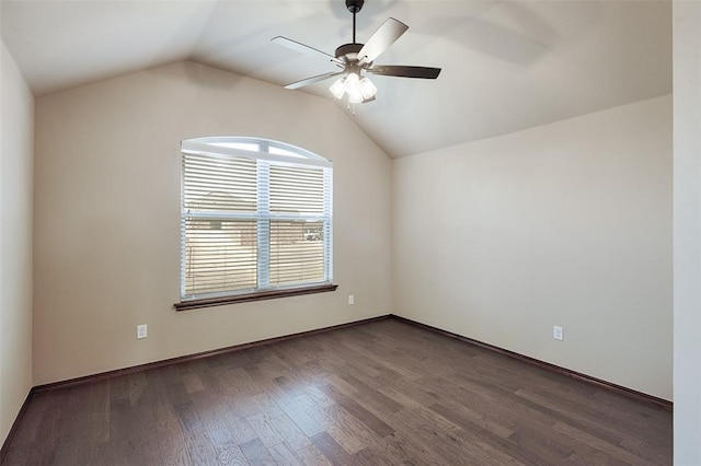 spare room with ceiling fan, dark hardwood / wood-style flooring, and vaulted ceiling