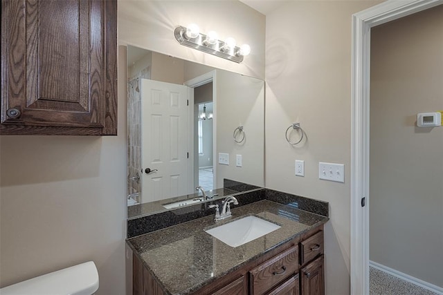 bathroom with vanity and toilet