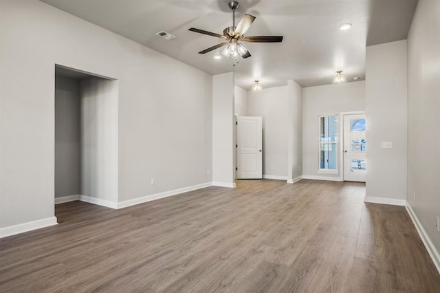 empty room featuring hardwood / wood-style flooring and ceiling fan