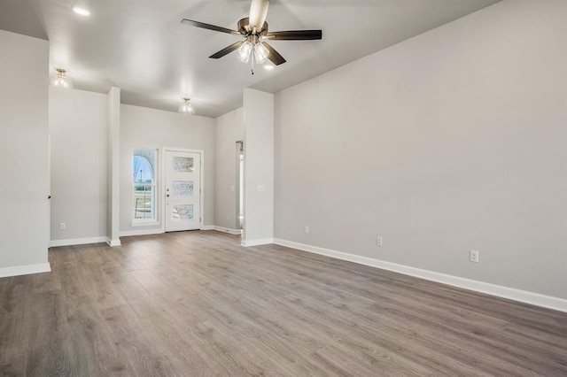 empty room with hardwood / wood-style flooring and ceiling fan