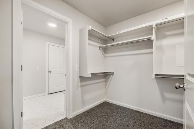 spacious closet with tile patterned flooring