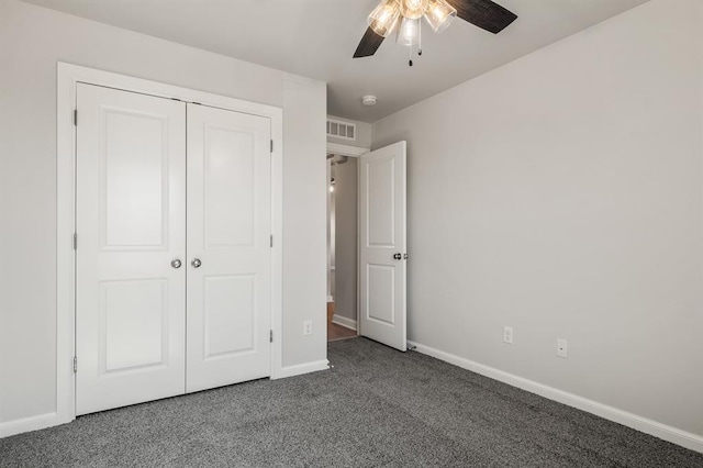 unfurnished bedroom featuring carpet flooring, a closet, and ceiling fan