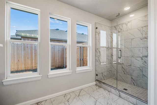 bathroom with a shower with shower door