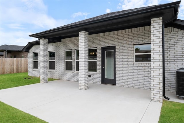 back of property featuring a patio area and central air condition unit