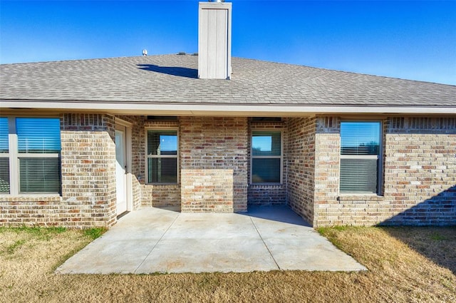 rear view of house with a patio