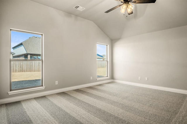 unfurnished room featuring carpet flooring, ceiling fan, and vaulted ceiling