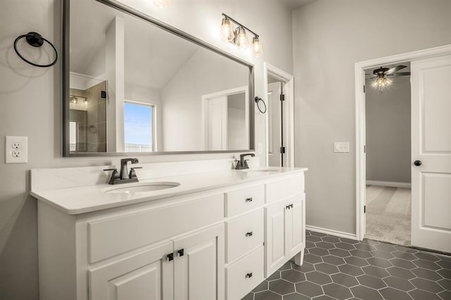 bathroom featuring vanity, vaulted ceiling, tile patterned flooring, ceiling fan, and walk in shower