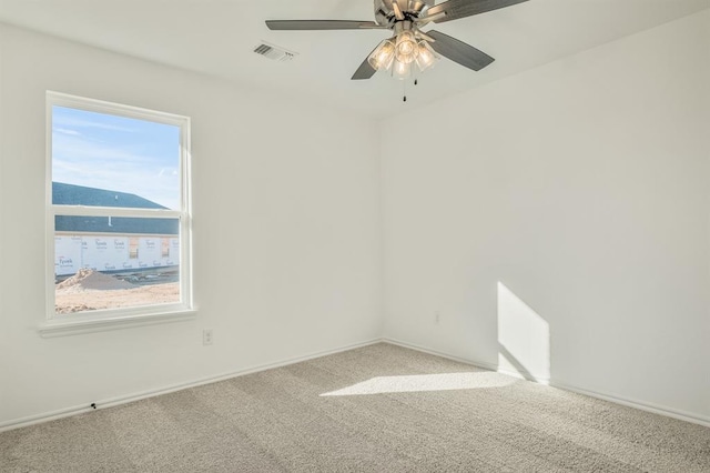 spare room featuring carpet flooring and ceiling fan