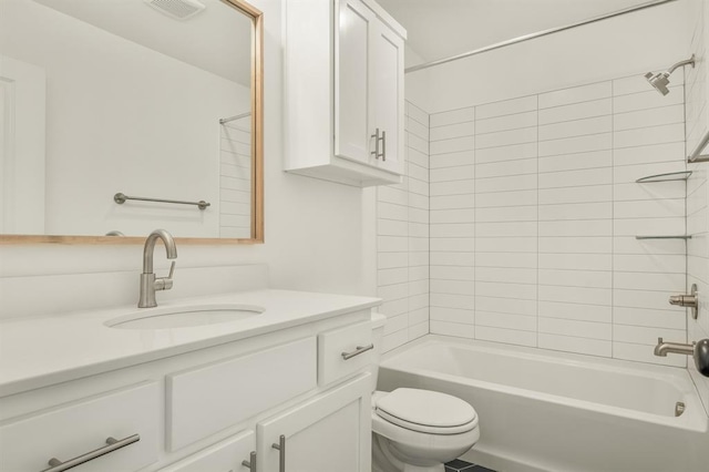 full bathroom with vanity, toilet, and tiled shower / bath