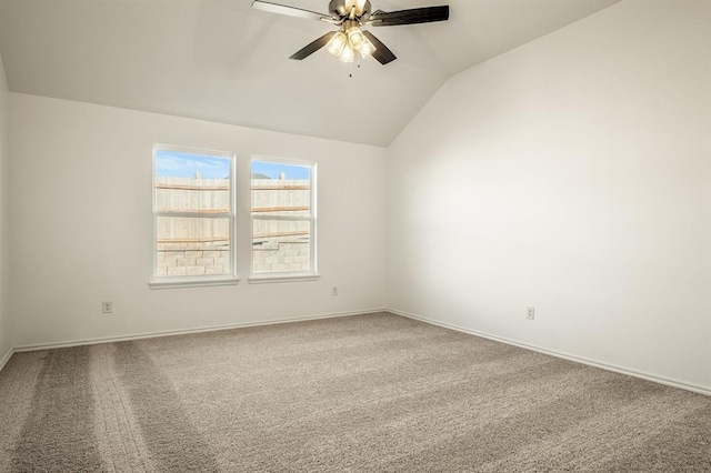 empty room with carpet, ceiling fan, and lofted ceiling