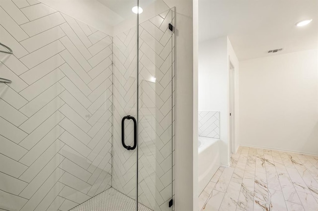 bathroom with shower with separate bathtub