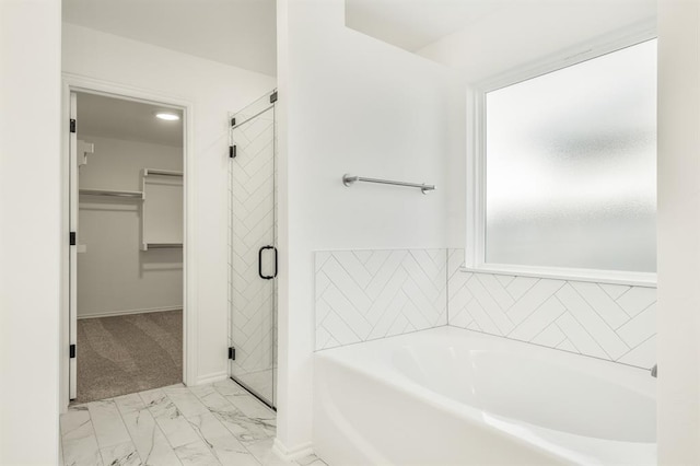 bathroom featuring plus walk in shower