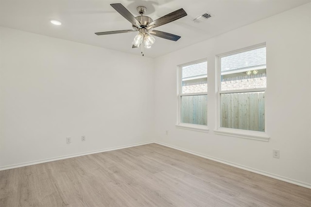 empty room featuring light wood-type flooring and ceiling fan