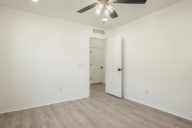 unfurnished room featuring ceiling fan and light wood-type flooring