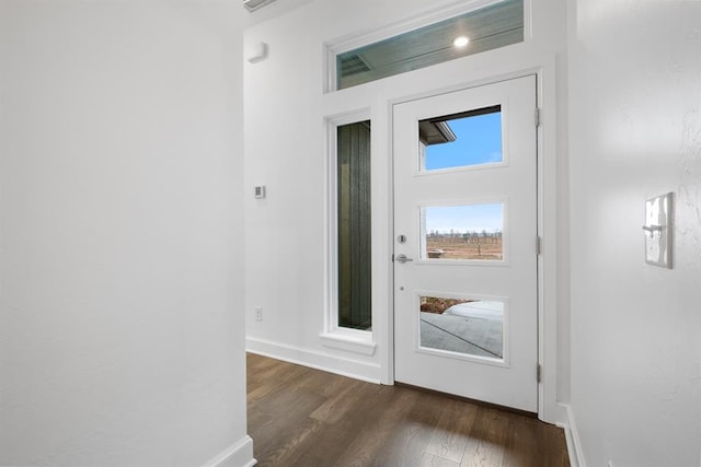 entryway with dark wood-type flooring