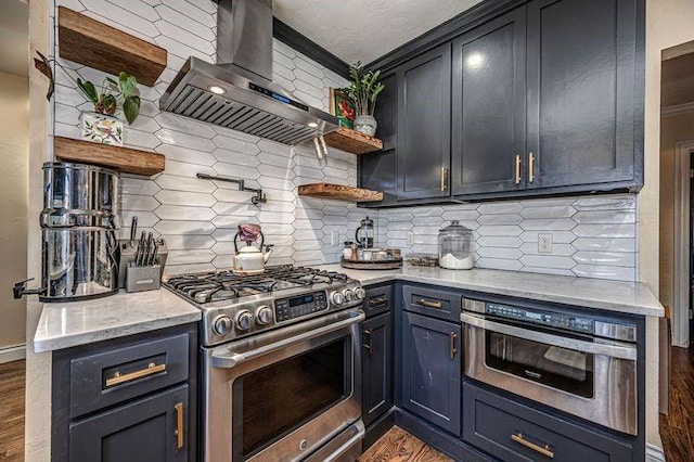 kitchen with open shelves, light stone counters, backsplash, appliances with stainless steel finishes, and wall chimney exhaust hood