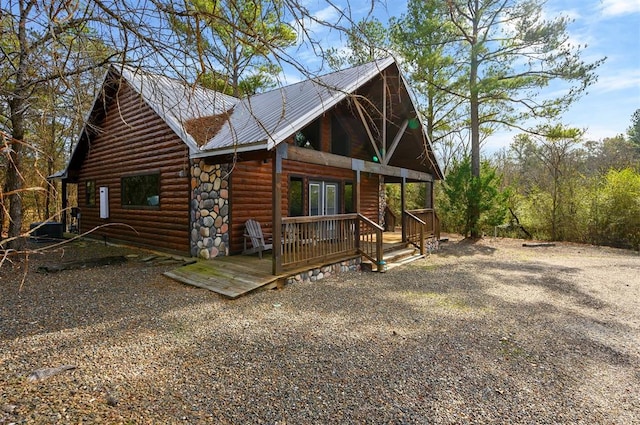 exterior space with a deck and french doors