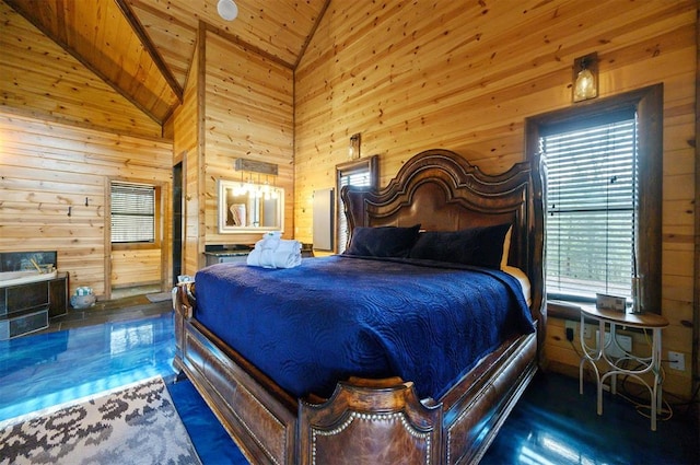 bedroom with wood walls, wood ceiling, and high vaulted ceiling