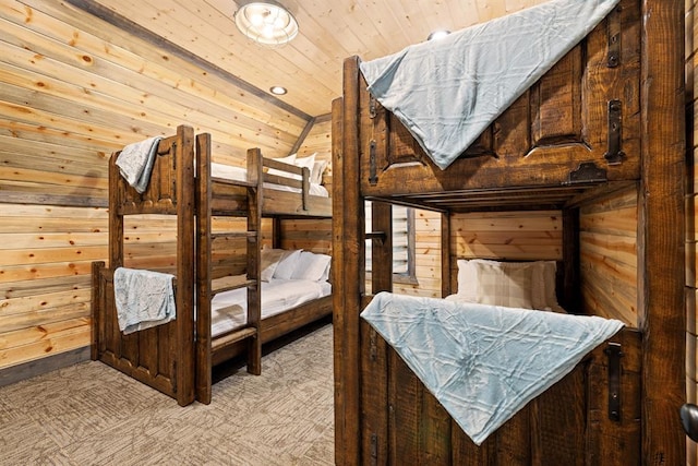 bedroom featuring wooden ceiling, wooden walls, and vaulted ceiling