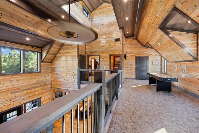 hall with wooden ceiling and wooden walls