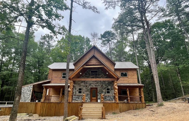 cabin featuring a porch