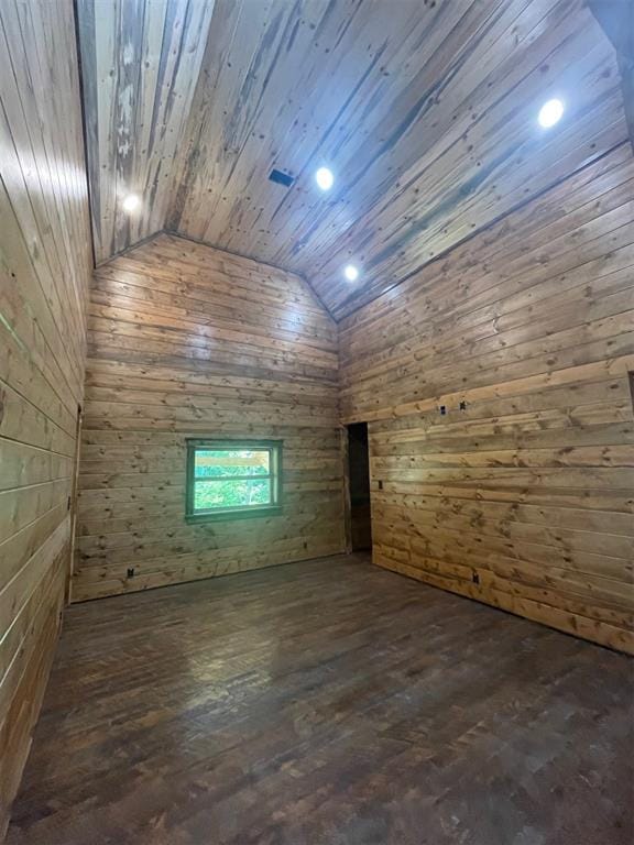 bonus room featuring wood walls, wooden ceiling, dark wood-type flooring, and vaulted ceiling