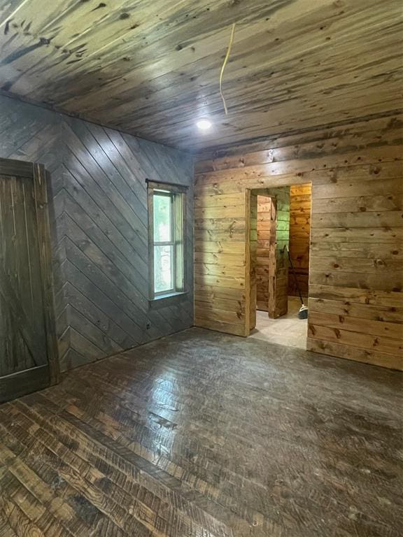 bonus room featuring wood walls and wood ceiling