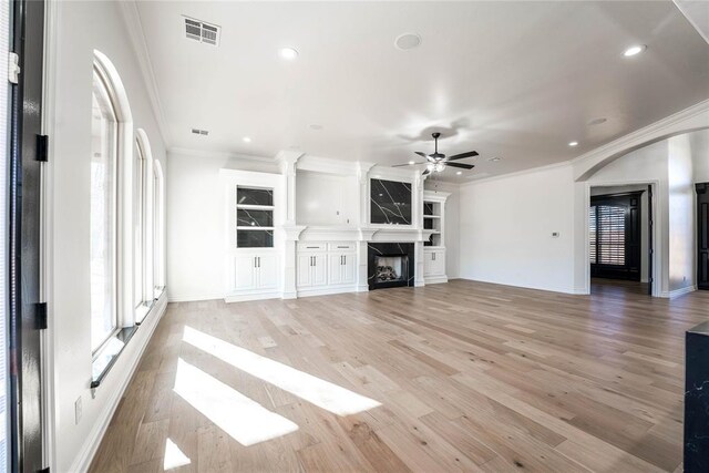 5900 N Choctaw Rd, Choctaw, OK 73020 - unfurnished living room featuring ceiling fan, a fireplace, crown molding, light wood-style flooring, and recessed lighting
