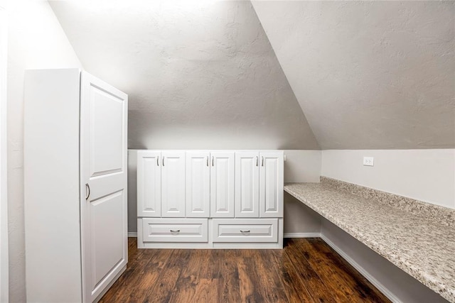 5900 N Choctaw Rd, Choctaw, OK 73020 - bonus room featuring dark wood-style flooring, a textured ceiling, and vaulted ceiling