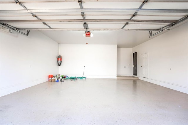 5900 N Choctaw Rd, Choctaw, OK 73020 - garage featuring a garage door opener