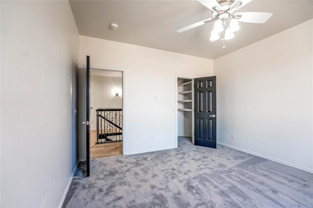 unfurnished bedroom featuring ceiling fan and light colored carpet