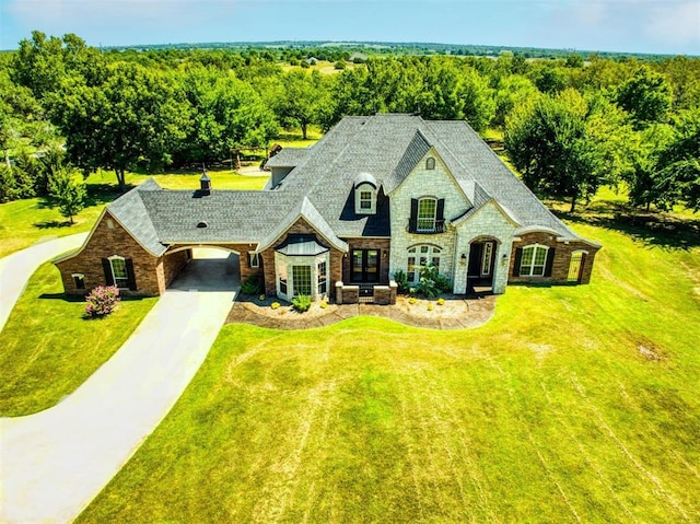 5900 N Choctaw Rd, Choctaw, OK 73020 - french provincial home featuring stone siding, a front lawn, concrete driveway, and a shingled roof