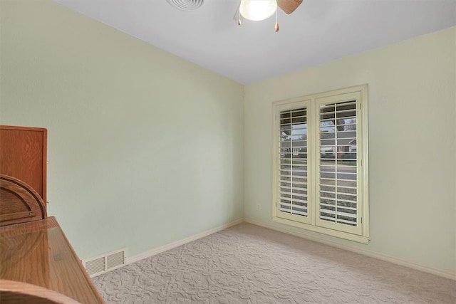 carpeted empty room with ceiling fan