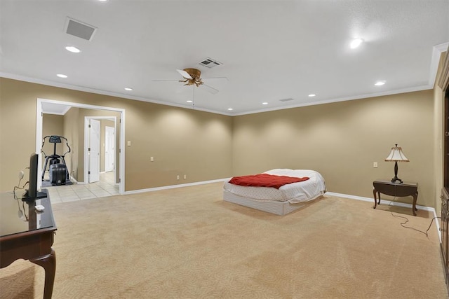 carpeted bedroom with ceiling fan and ornamental molding