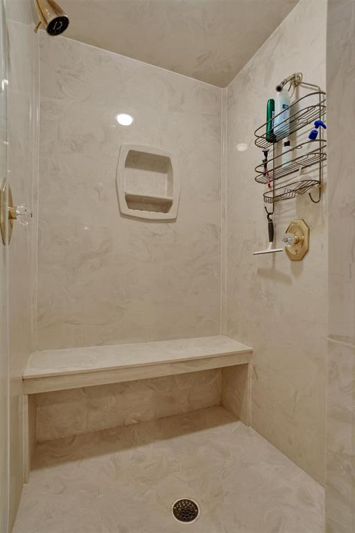 bathroom with a tile shower