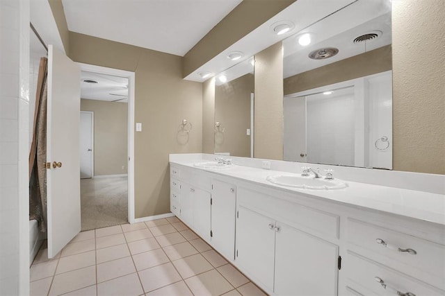 bathroom featuring tile patterned floors and vanity