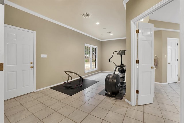 exercise area featuring light tile patterned flooring and crown molding