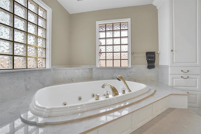 bathroom with tiled bath