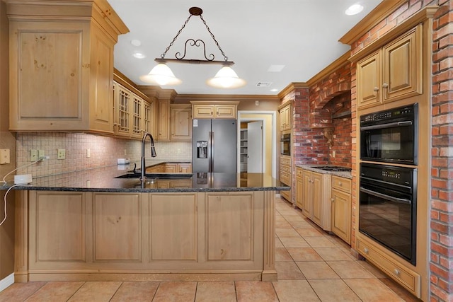 kitchen with double oven, kitchen peninsula, pendant lighting, and stainless steel refrigerator with ice dispenser