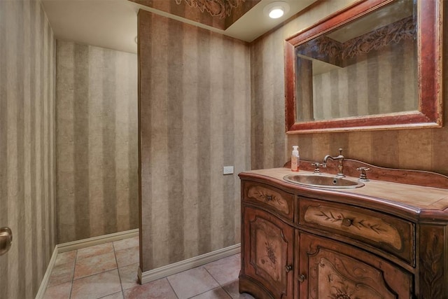 bathroom featuring tile patterned flooring and vanity