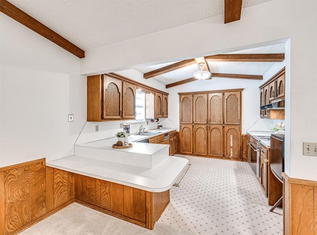 kitchen with light carpet, kitchen peninsula, sink, vaulted ceiling with beams, and stainless steel electric range oven