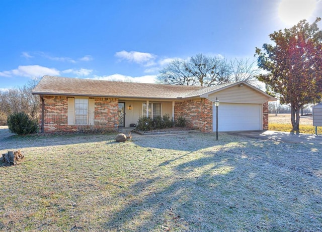 ranch-style house with a garage and a front lawn