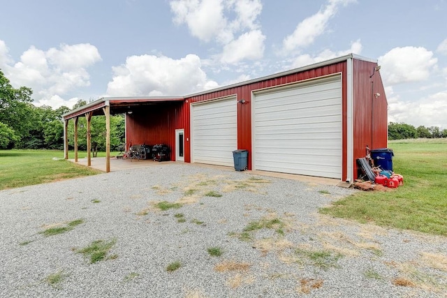 garage featuring a lawn