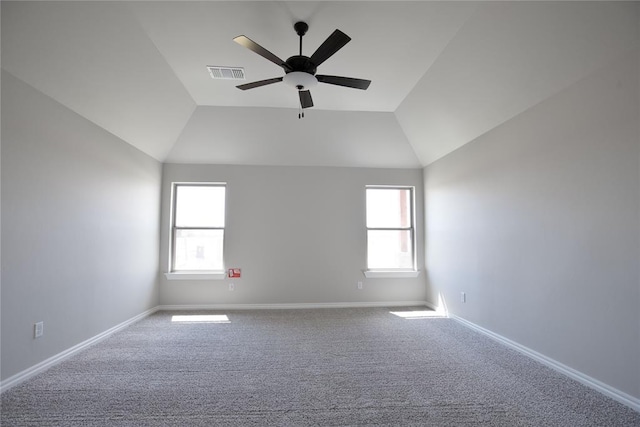 empty room featuring carpet flooring, ceiling fan, and lofted ceiling