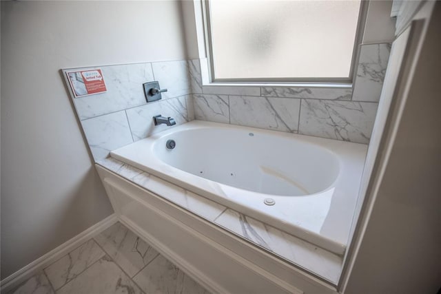 bathroom with tiled tub