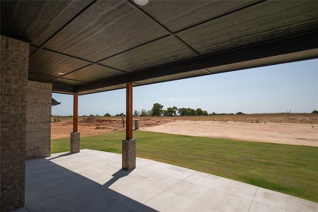 view of patio / terrace with a rural view