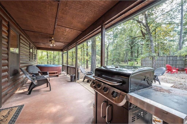 view of patio / terrace with a hot tub