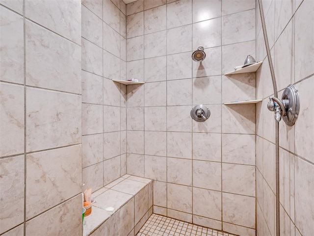 bathroom with a tile shower