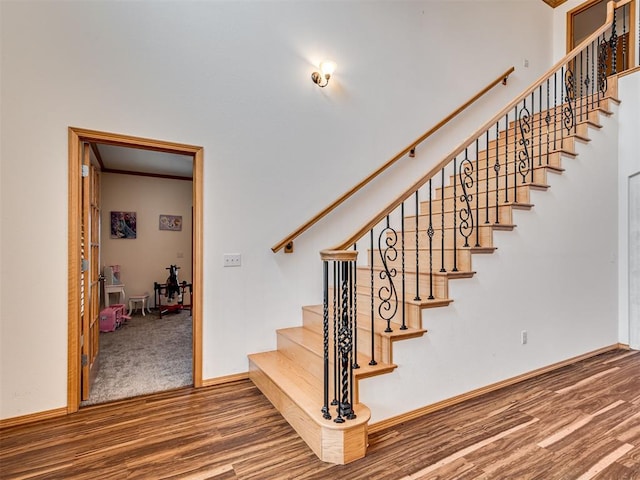 staircase featuring hardwood / wood-style flooring